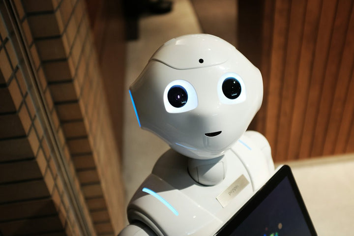 white robot near brown wall — illustrative stock photo